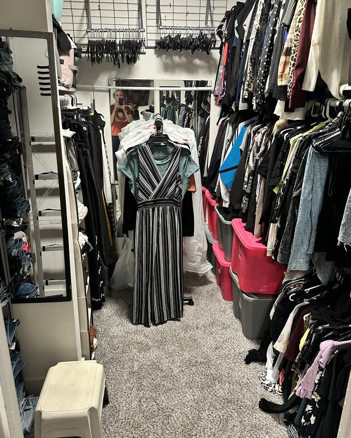 After: the same closet with clothes hung in rows and a clear carpet