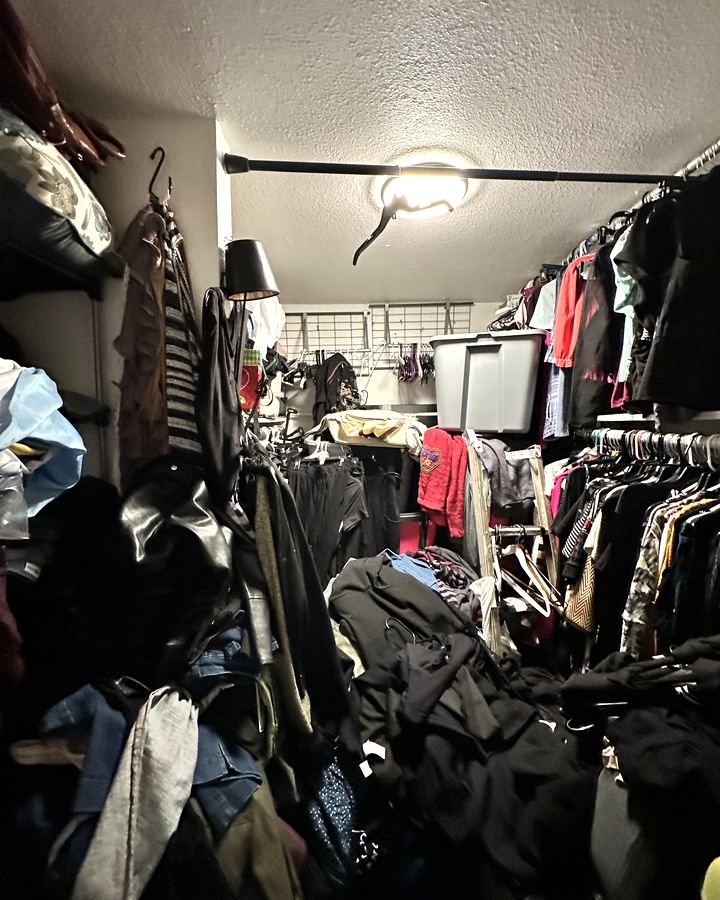 Before: a walk-in closet with clothes piled across the floor