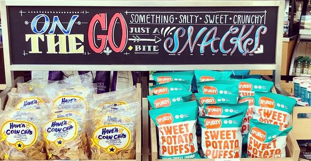 Hand-lettered On the Go snacks header above a snack display