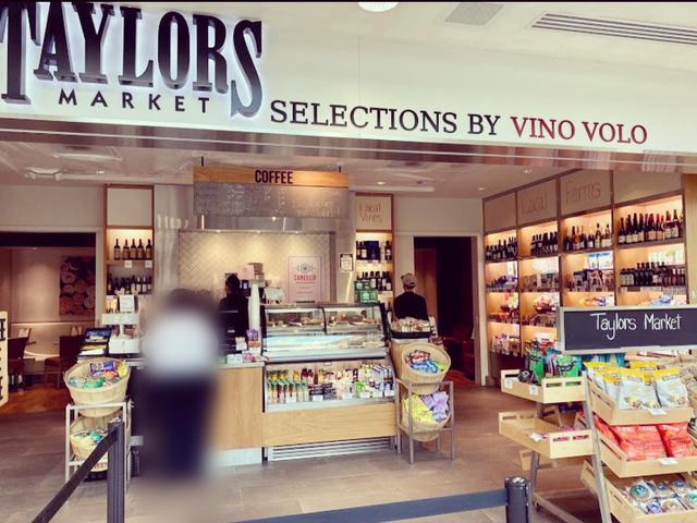 The airport market storefront where the signs are displayed